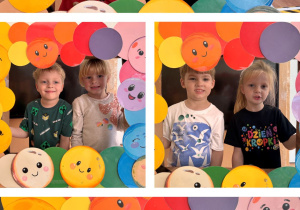 Dzieci pozują do zdjęcia w ramce z kolorowymi kropkami