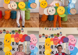 Dziecki trzymają ramkę z okazdji Dnia Kropki,