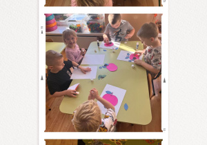 Dzieci wykonują pracę plastyczną - jabłko